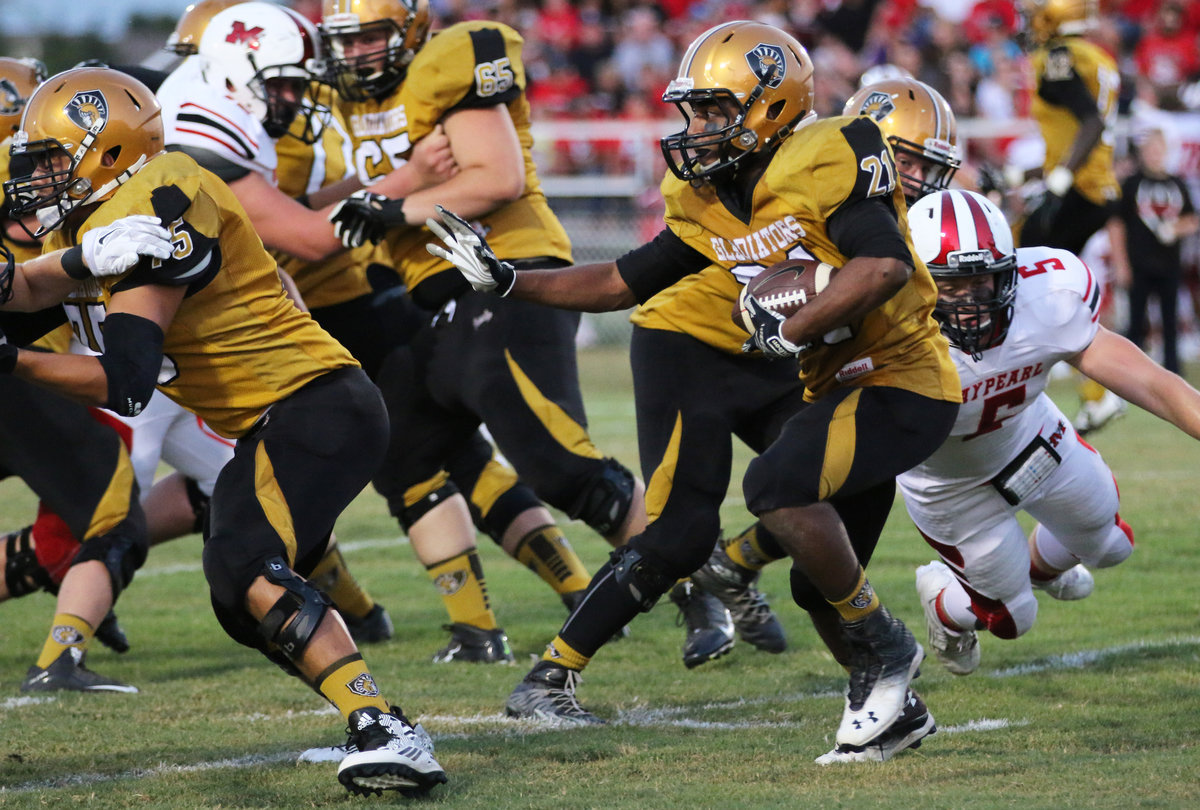 Image: Gladiator and senior running back Jaray Anderson(21) uses offensive tackle David De La Hoya(75) as a shield against Maypearl.