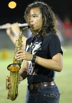 Image: April Lusk is in the zone during the halftime show performed by the Italy Gladiator Regiment Band.