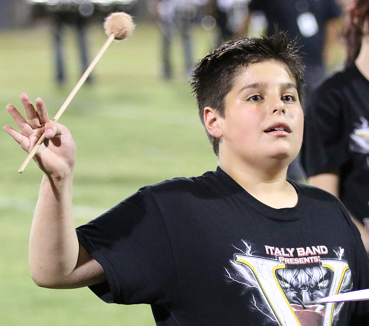 Image: Italy Gladiator Regiment Band member Mikey South gives a quick wave to his parents Mike and Tessa South.