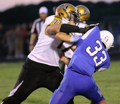 Image: Junior offensive lineman Aaron Pittmon(72) protects his QB’s blind side.
