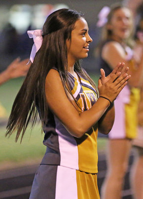 Image: Italy HS Cheerleader and Senior Co-Captain Ashlyn Jacinto keeps that spirit up on the road in Blooming Grove.