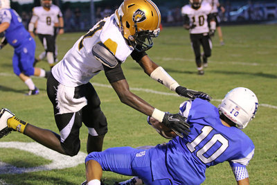 Image: Italy cornerback Chasston King(12) makes a tackle along the sideline.
