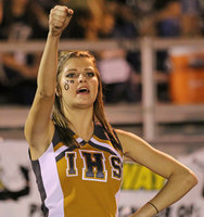 Image: Italy HS Cheerleader Halee Turner, a senior, urges the Gladiators forward against the Lions.