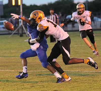 Image: Chasston King(12) breaks up a Blooming Grove pass attempt.