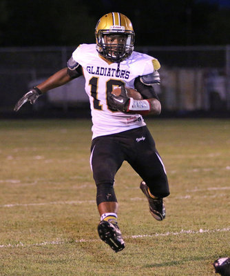 Image: Sophomore running back Kendrick Norwood(10) returns a kickoff for the Gladiator cause.