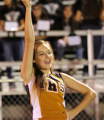 Image: Jozie Perkins cheers for her guys late into the fourth-quarter against Blooming Grove.