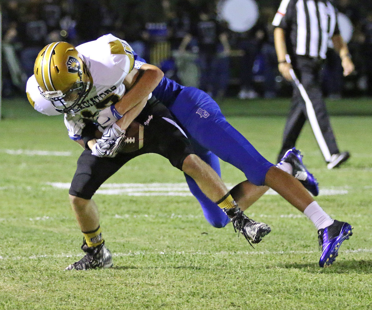 Image: Italy receiver Garrett Janek(17) brings in a pass despite tight coverage by the Lions.