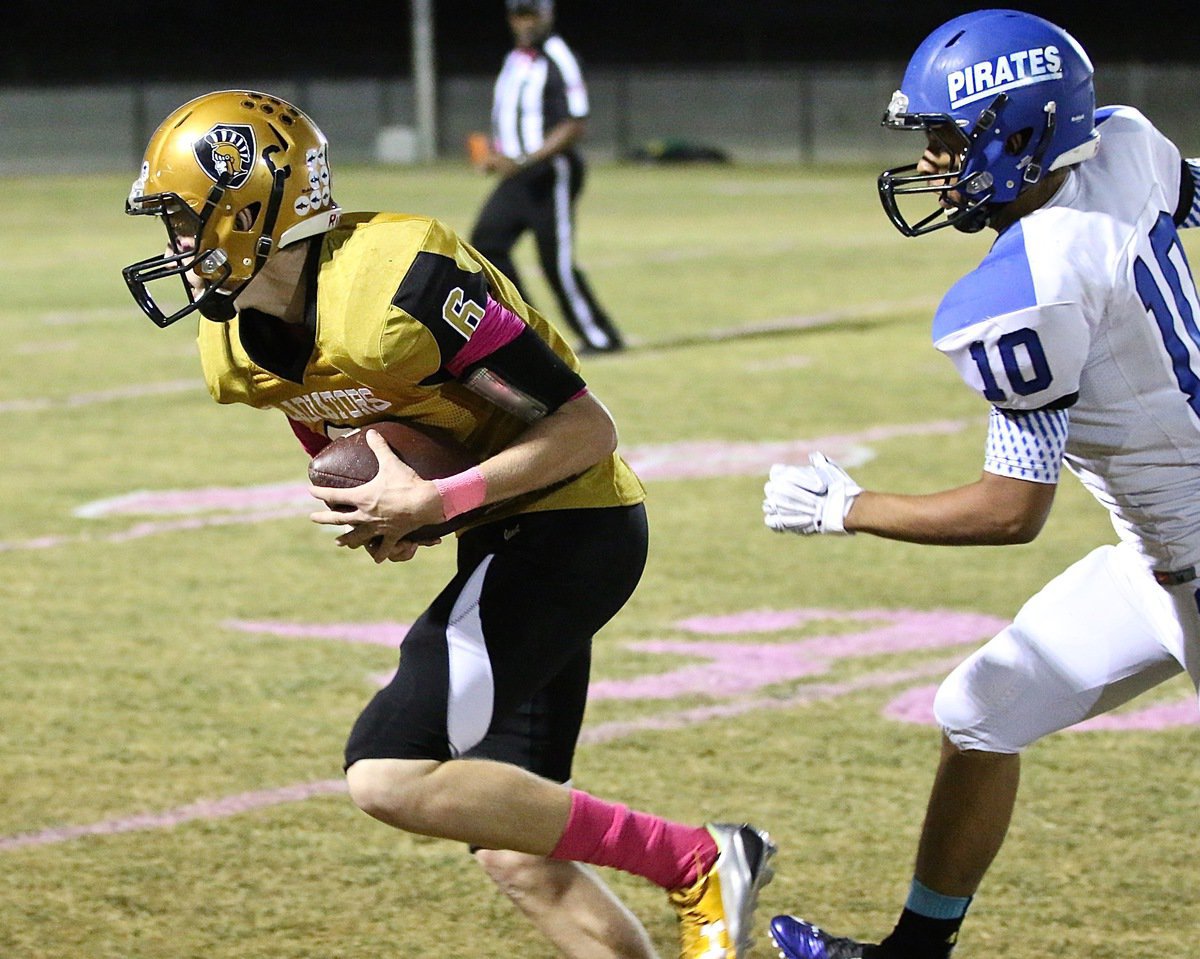 Image: Senior Gladiator receiver Clayton Miller(6) pulls in a catch from quarterback Ryan Connor for a big gain against the Pirates.