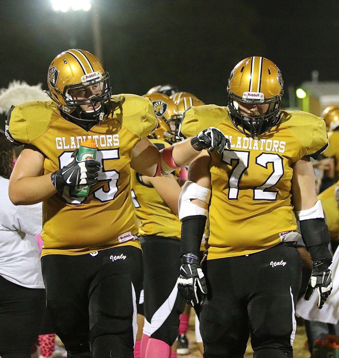 Image: Beast Brothers Austin Pittmon(65) and Aaron Pittmon(72) do everything together wether its taking a water break or winning a football game. Twinning!