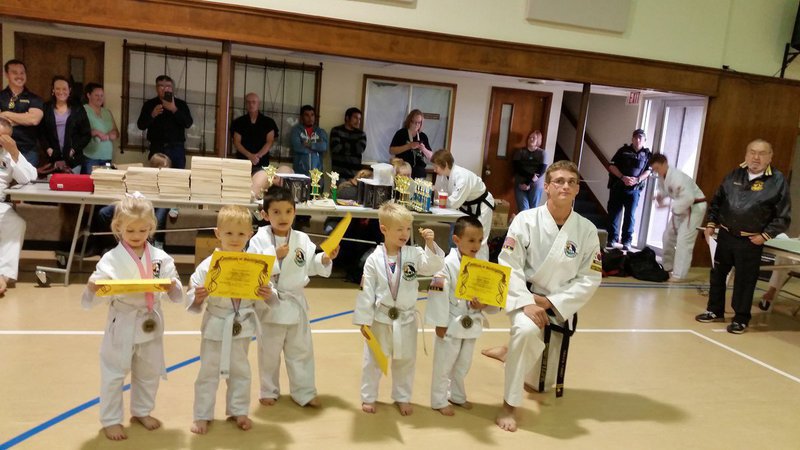 Image: Pictured below are 5 Turtle Cadets and Travis Tinney 2nd Degree Black Belt and Turtle Cadet instructor.   Students below are Harmony McKnight-Whitney, Triston Klanika-Waco,  Dominick Benitez-Hillsboro, Christian McKnight-Whitney and Noah Hayes-Italy.