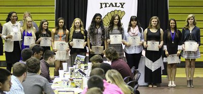 Image: The Varsity Volleyball Team was honored along with Head Coach Laquita Walker (far left) who was named the district’s Coach-of-the-Year. Players receiving certificates were (L-R): Hannah Washington, Cassidy Childers, April Lusk, Brycelen Richards, Janae Robertson, Jozie Perkins, Jenna Holden, Lillie Perry, Ashlyn Jacinto and Halee Turner.