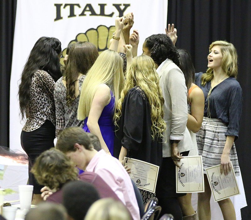 Image: The Lady Gladiator Volleyball Team shares one last huddle together to officially end the season.
