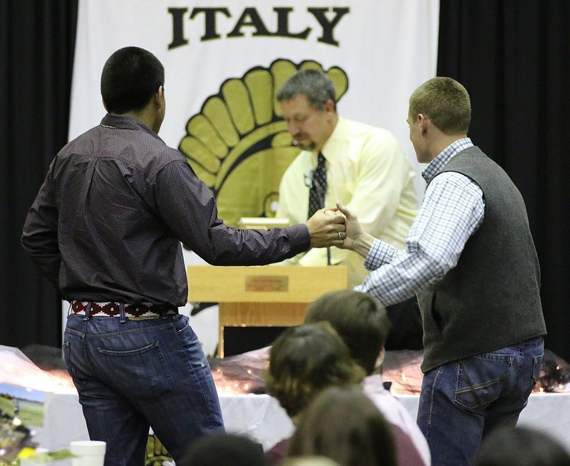Image: David De La Hoya and Clay Riddle are both presented the first ever Italy Gladiator Football Co-Lineman Award by Coach Sean Connor.