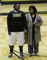 Image: Senior Lady Gladiator Shercorya Chance is honored during the Senior Night 2K16 pregame celebration while being escorted by her mom, Cynthia Chance.