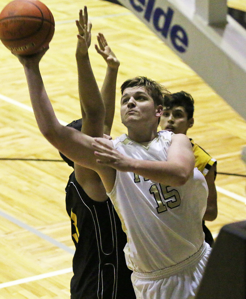 Image: Italy JV Gladiator James Walton(15) rises up for 2-points over the Itasca defense. Walton finished with 8-points.