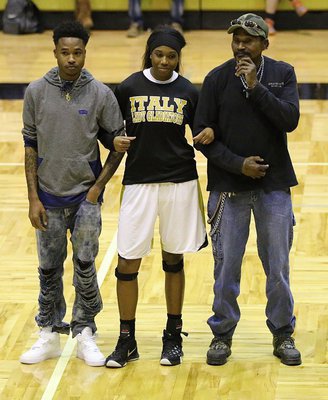 Image: Senior Lady Gladiator Janae Robertson is honored during the Senior Night 2K16 pregame celebration while being escorted by her brother, Tavares Griffin, and her father, Johnny “Bang” Williams.