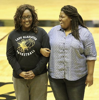 Image: Senior Lady Gladiator and dedicated manager Brenya Williams is honored during the Senior Night 2K16 pregame celebration while being escorted by her sister, Gwendolyn Williams.