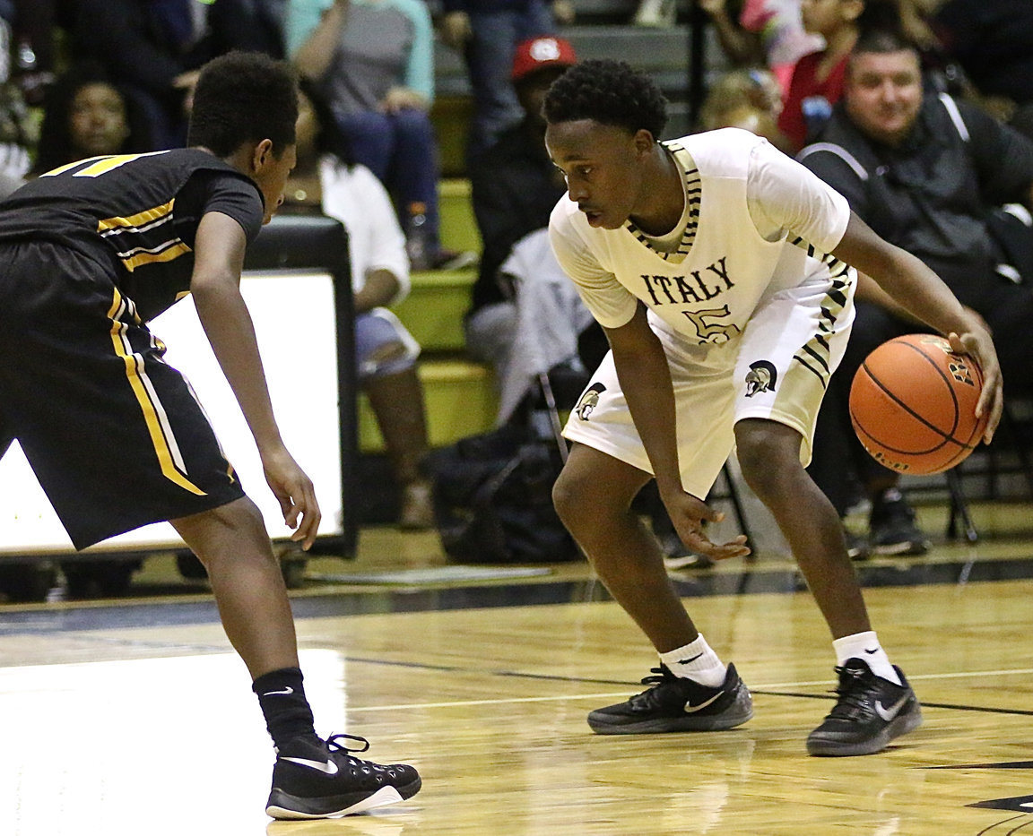 Image: Italy point guard Kevin Johnson(5) displays the skills while having a 10-point scoring night against Itasca.