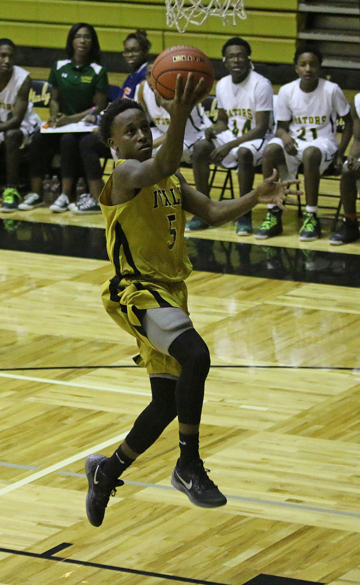 Image: Kevin Johnson(5) led Italy with a 20-point night to help the Gladiators overtake district rival Dallas Gateway, 66-65. Italy is now the front runner of the district.