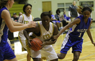 Image: Senior Taleyia WIlson(22) scored 4 second-half points while battling in the trenches for the Lady Gladiators.