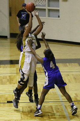 Image: Emily Cunningham(2) turns a steal into 2-points for the Lady Gladiators.