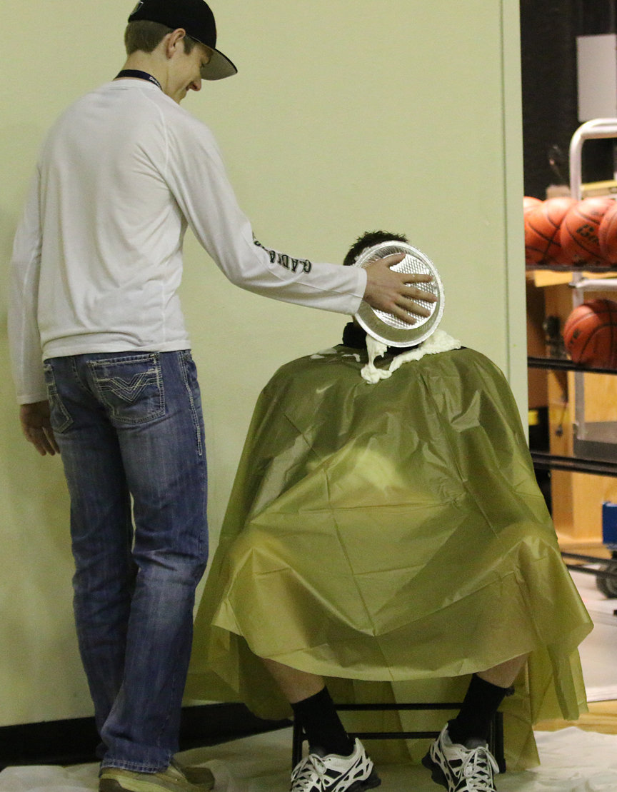 Image: At halftime, Senior Clayton Miller, Italy Gladiator Football’s 2016 Team MVP, applies a pie in the face to AD/HFC David Weaver as a fundraiser for the Gladiator Athletic Booster Club.