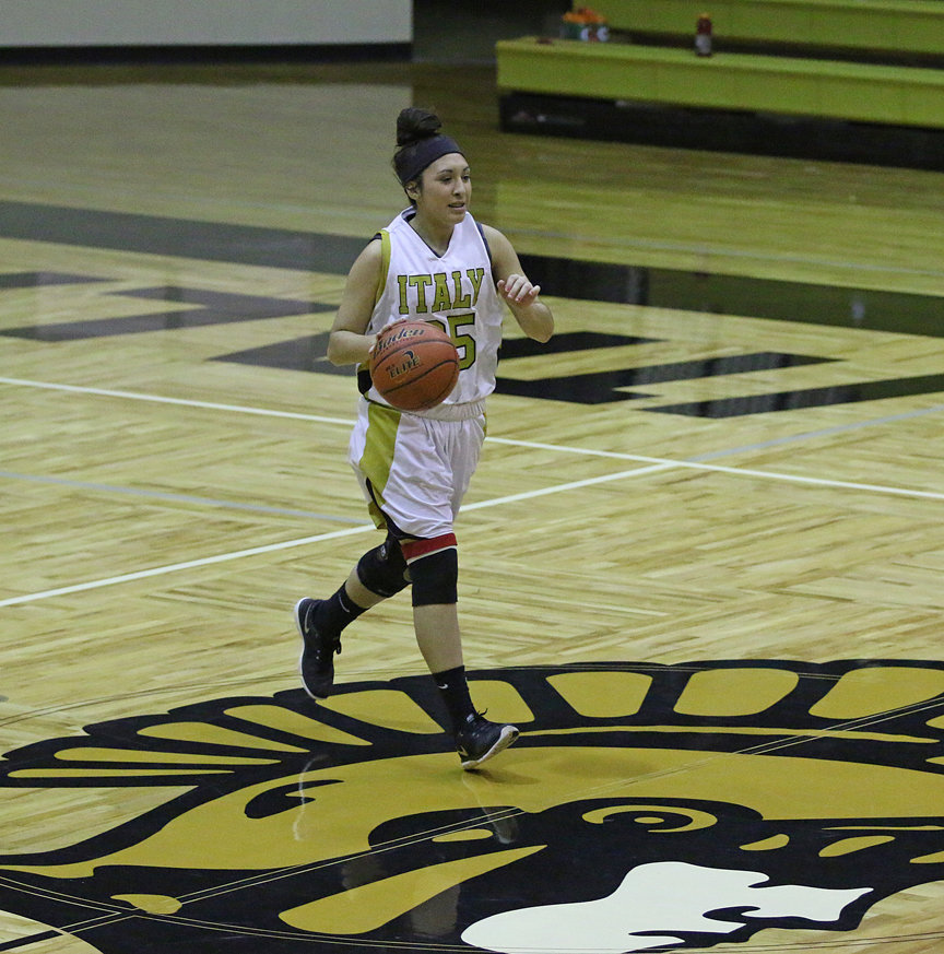 Image: Lizzie Garcia(25) runs the point late in the game for the Lady Gladiators.