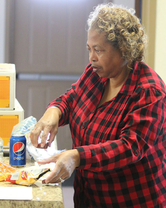 Image: Connie Singleton helps keep everybody well fed and having a good time.