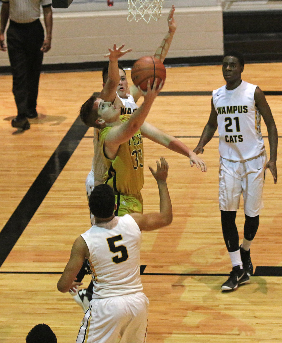 Image: A little razzle-dazzle from the rookie, James Walton(33), as he uses a reverse shot to score against the Wampus Cats.