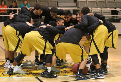 Image: The Gladiators get krunk at center court before their last district battle against the Itasca Wampus Cats.