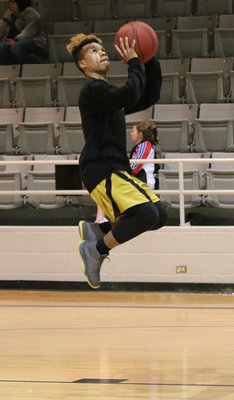 Image: Jeremiah Thompson floats to the hoop during warmups.