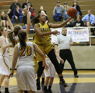 Image: Lady Gladiator Emmy Cunningham(2) tries a scoop shot as she pierces thru the Lady Hornet defense.