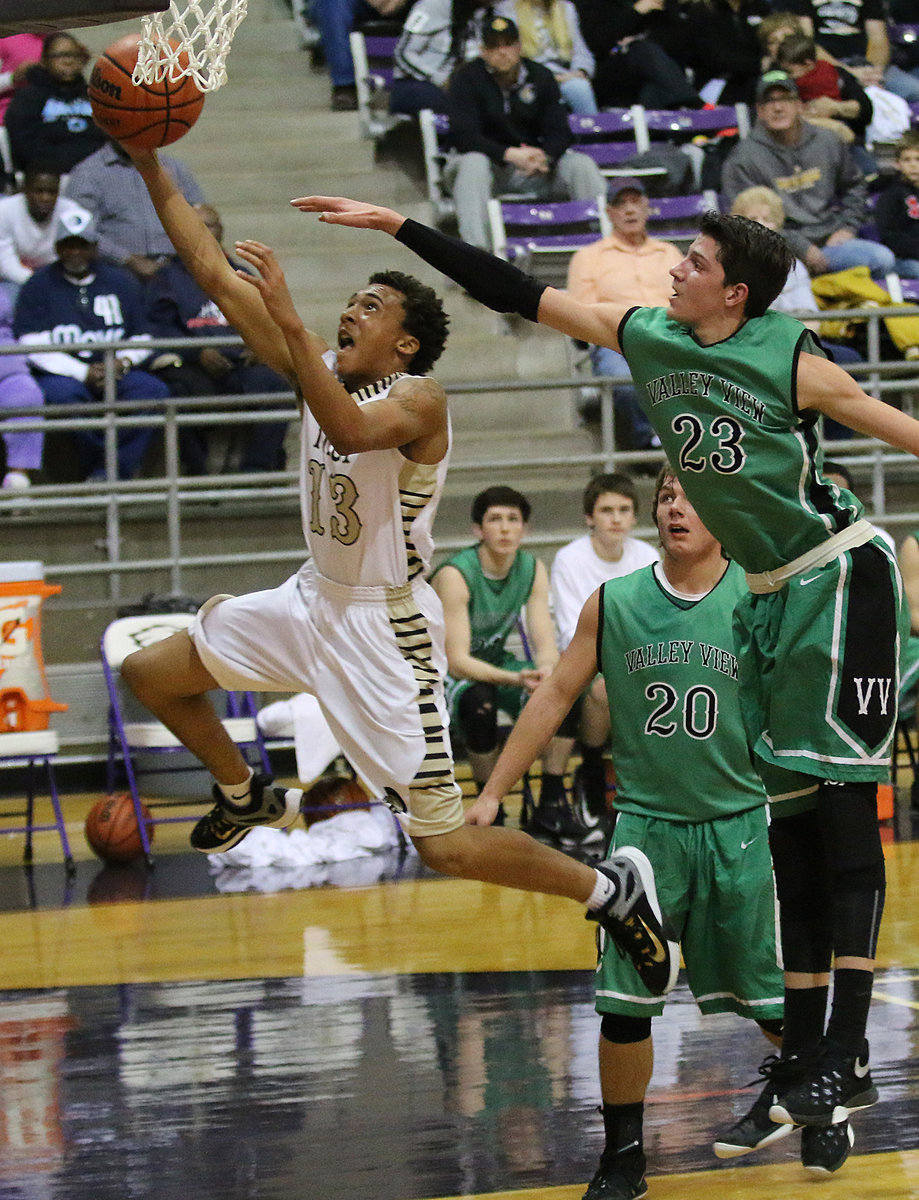 Image: Gladiator Keith Davis II (13) is fouled on his way to the basket as Italy removes Valley View from the Class 2A playoffs with a 67-56 bi-district win over the Eagles.