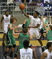Image: Point guard Kevin Johnson(5) helps lead the way for the Gladiators who will be moving on to the Area round of the playoffs after Johnson and his teammates defeated Valley view for the bi-district championship.