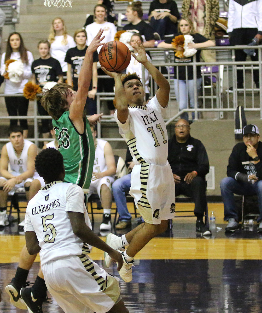 Image: Jeremiah Thompson(11) goes in for a layup for the Gladiators.