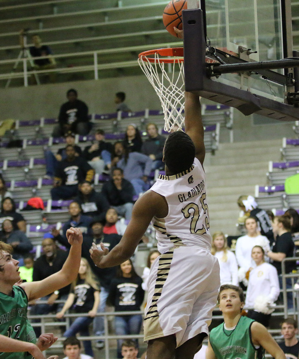 Image: Italy Gladiator Christian Lightfoot(25) goes up for a dunk attempt against the Valley View Eagles.