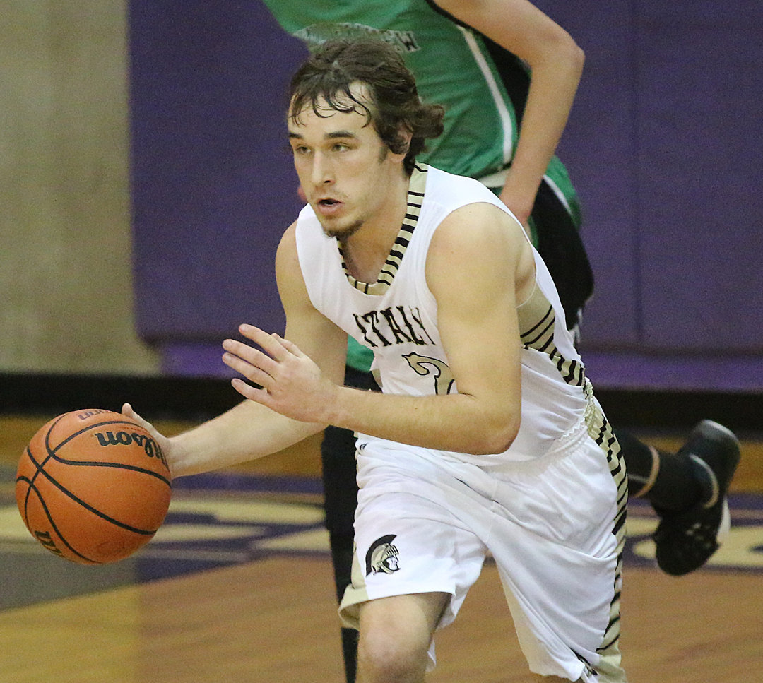 Image: Italy’s Ryan Connor(2) turns defense into offense as he pushes the ball up the floor after securing a rebound.