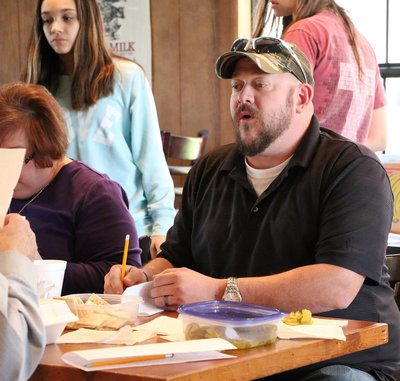 Image: Nathan Carr helps judge the Lions Club Cook-Off with his daughter Hannah Carr earning community service hours as volunteer student from the Italy Jr. High School.