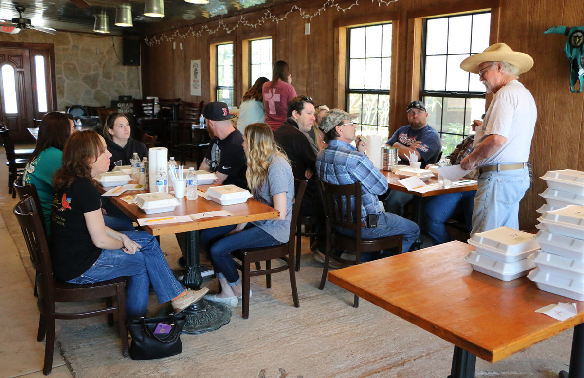 Image: Judge Coordinator Royce Williams (far right) goes over the rules for judging the next event.