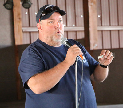 Image: Event MC Scott Otto, and one of the manager’s of the Rockett Ranch Café that hosted the Cook-off, begins to call out the competition winners.