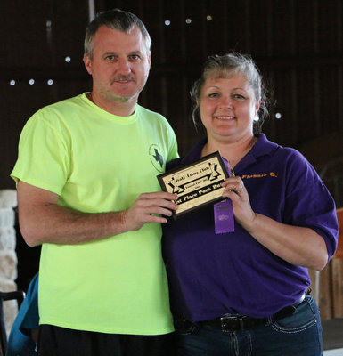 Image: Italy Lions Club member Flossie Gowin presents Randy Brumbelow with his 1st Place Pork Butt plaque and his participation ribbon. 1st Place paid $210.00.