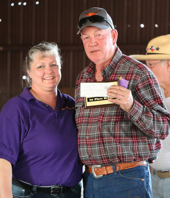 Image: Italy Lions Club member Flossie Gowin presents Scott Parks with his1st Place Brisket plaque, his participation ribbon, and a winner’s check for $210.00.