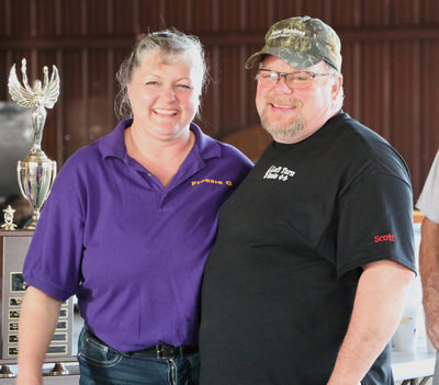 Image: Italy Lions Club member Flossie Gowin congratulates Scott Blanchard, owner of BHB Feed &amp; Supply, LLC of Italy, for his 3rd Place finish in the local Braggin’ Rights category.