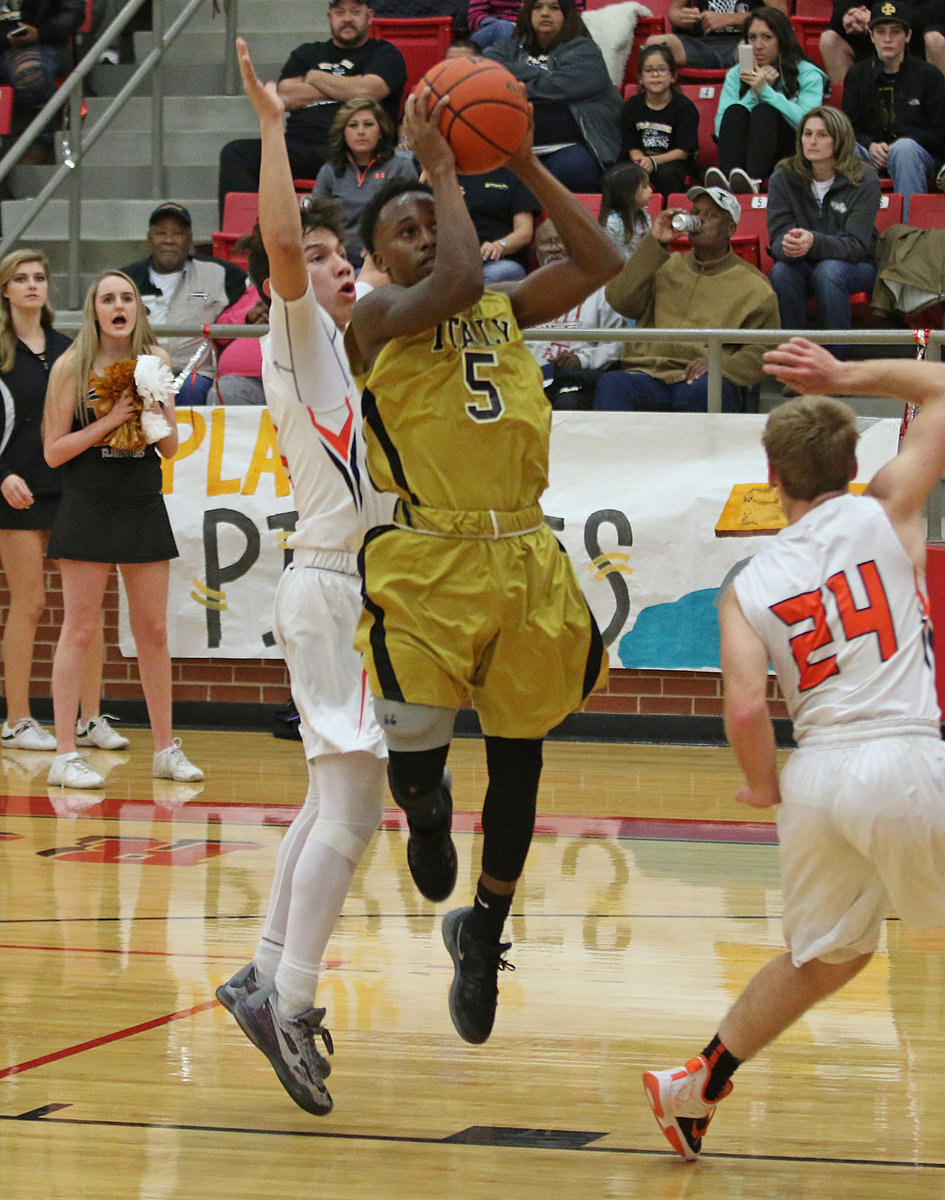 Image: Gladiator Kevin Johnson scores a fast break basket against Petrolia.