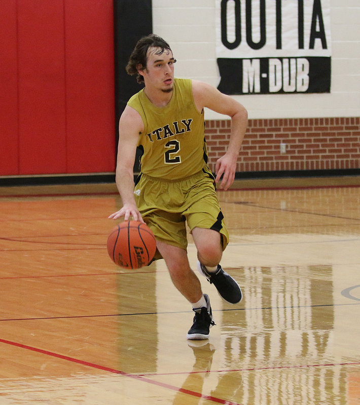 Image: Senior Gladiator Ryan Connor hurries the ball up the court against Petrolia at area,
