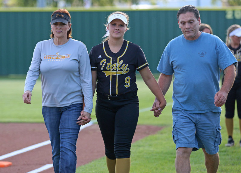 Image: Italy Lady Gladiator senior Lillie Perry is escorted by her parents before the game while being honored during Senior Day as mother, Deborah Perry tries hold back those tears.