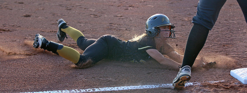 Image: Senior Lady Gladiator Britney Chambers(4) goes all out as she slides safely into third during bi-district battle between Italy and Riesel. Chambers helped lead Italy to a 13-1 game 1 win in a best 2-out of-3 series. Reisel won the next 2 games, however, to claim the bi-district championship.