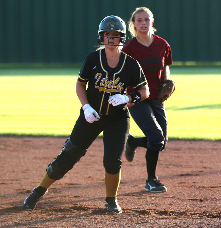Image: Junior Lady Gladiator Brooke DeBorde(2) looks for a chance to reach second-base against Riesel.