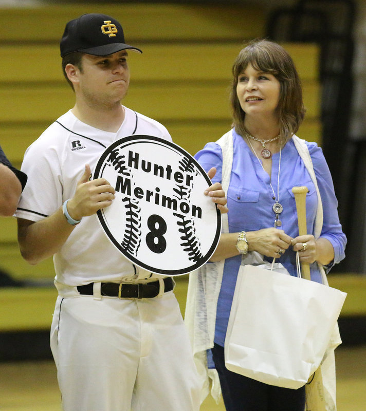 Image: Senior Italy Gladiator Baseball member Hunter Merimon(8) is escorted by his mother, Michelle Parker Merimon, for Senior Night during a post-game ceremony.