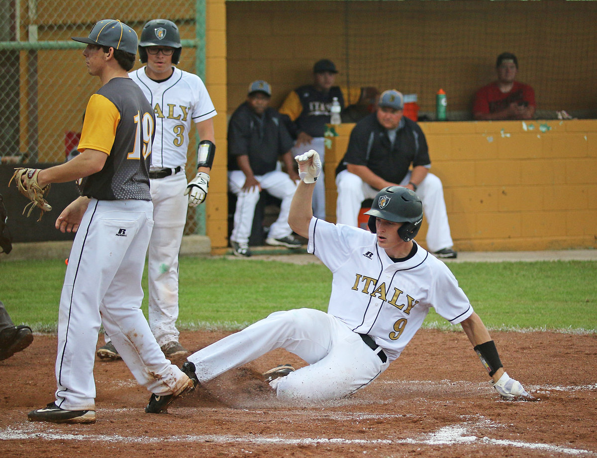 Image: Italy Gladiator Clay Riddle(9) slides safely home off a wild-pitch thrown by Itasca as teammate Eli Garcia(3) stays clear.